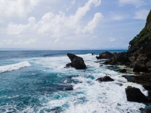 Image of rocky beach with crashing waves | Hero image for Resilience Building for SUD professionals