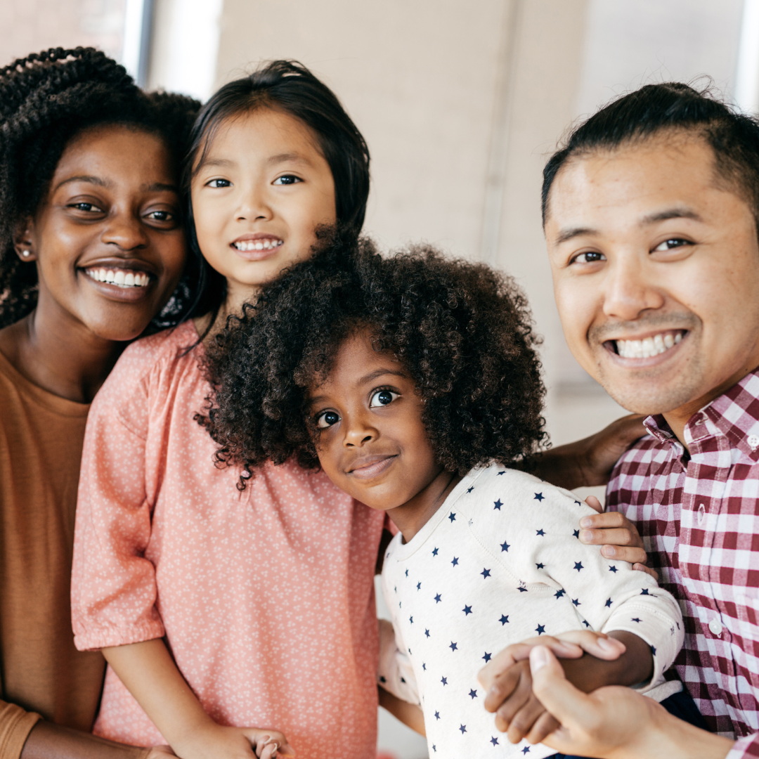 Image of a family including a father,, mother, and two daughters. Featured image for "embracing families" training