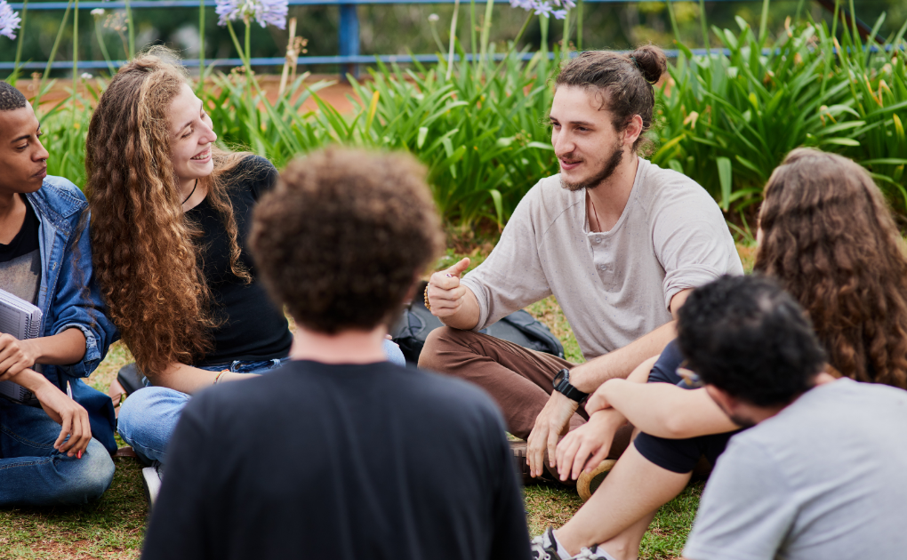 Young people sitting in a circle \ hero image for community-based recovery